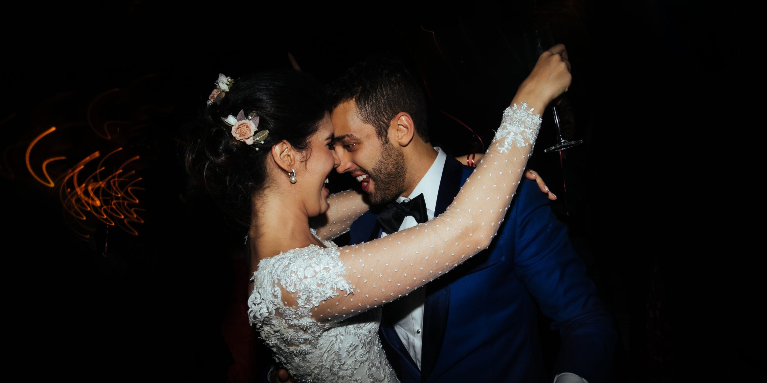 A bride and groom smiling at each other