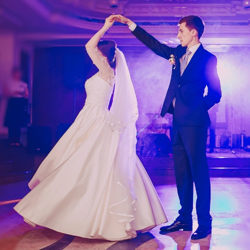 A bride and groom dancing